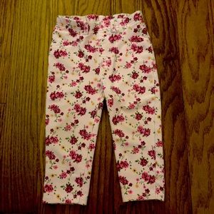 Light pink pants with small red and pink roses
